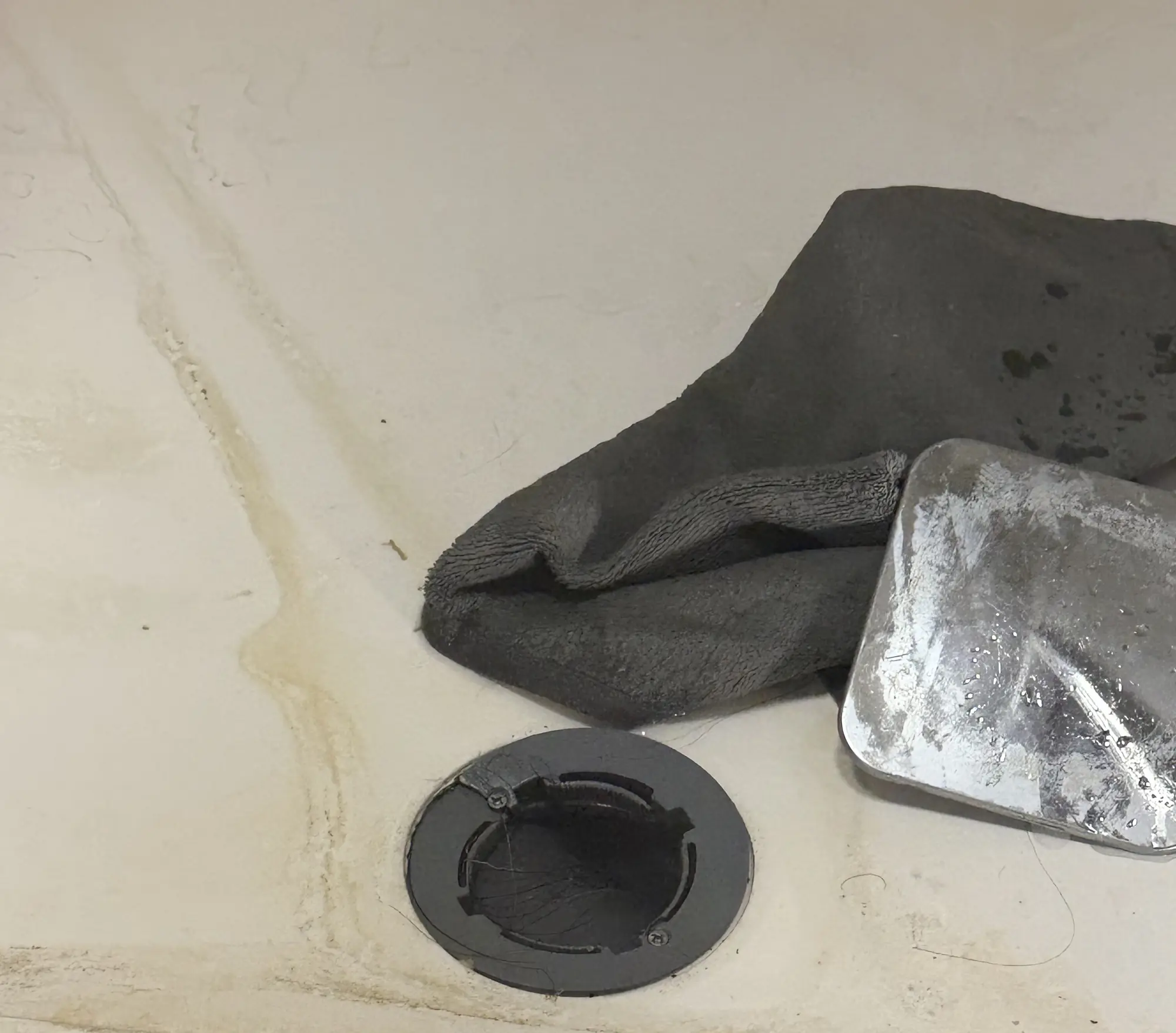 A blocked waste outlet exposed during a drainage repair.
